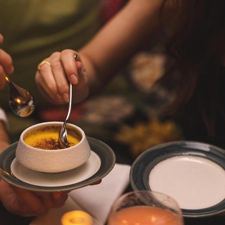 Hotel Pigalle Gothenburg Ngoại thất bức ảnh A woman using a spoon to eat a dessert