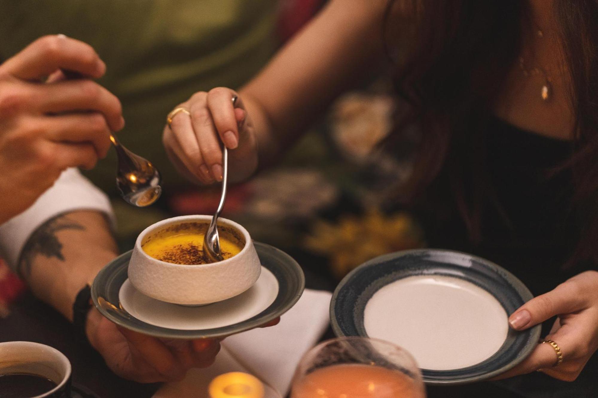 Hotel Pigalle Gothenburg Ngoại thất bức ảnh A woman using a spoon to eat a dessert